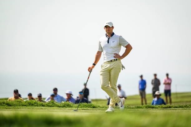 Rory McIlroy of Northern Ireland waits to putt on the fifth hole green during the first round of the 121st U.S. Open on the South Course at Torrey...