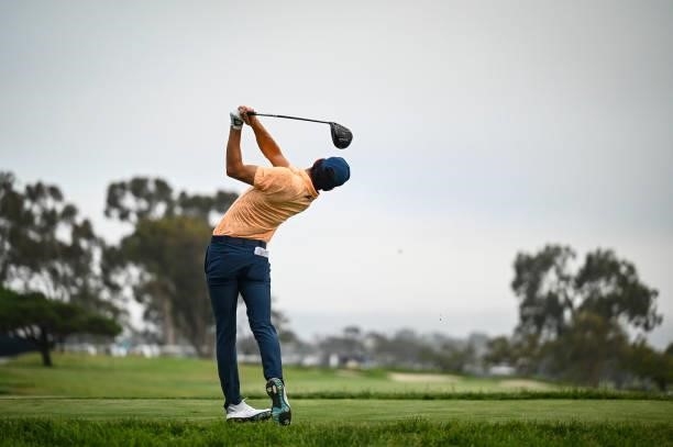 Joaquin Niemann of Chile follows through as he plays his shot from the seventh tee during the first round of the 121st U.S. Open on the South Course...