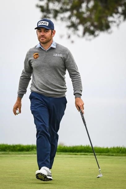 Louis Oosthuizen of South Africa walks off the fifth hole green after making a birdie putt during the first round of the 121st U.S. Open on the South...