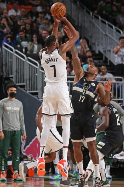 Kevin Durant of the Brooklyn Nets shoots the ball over P.J. Tucker of the Milwaukee Bucks during Round 2, Game 6 of the 2021 NBA Playoffs on June 17,...