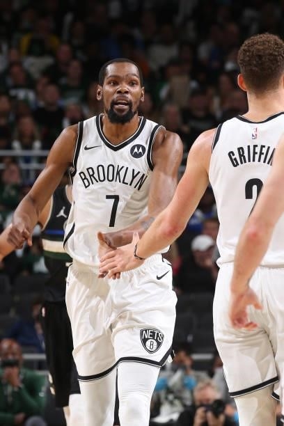 Kevin Durant and Blake Griffin of the Brooklyn Nets high five in the game against the Milwaukee Bucks during Round 2, Game 6 of the 2021 NBA Playoffs...