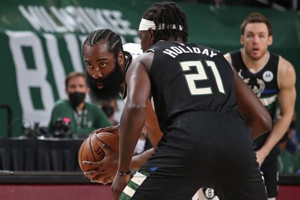 Jrue Holiday of the Milwaukee Bucks plays defense on James Harden of the Brooklyn Nets during Round 2, Game 5 of the 2021 NBA Playoffs on June 17,...