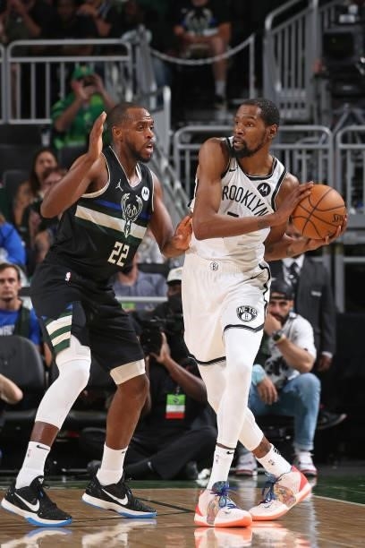 Khris Middleton of the Milwaukee Bucks plays defense on Kevin Durant of the Brooklyn Nets during Round 2, Game 5 of the 2021 NBA Playoffs on June 17,...