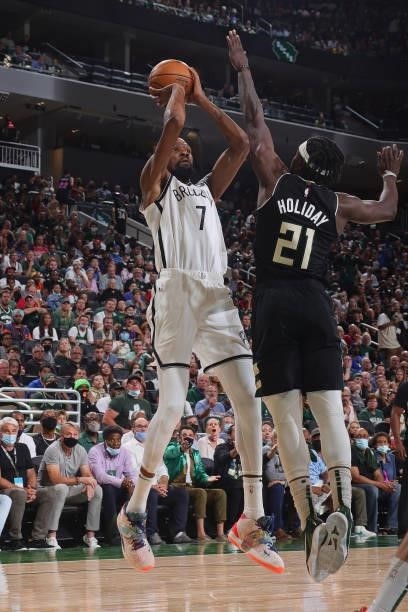 Kevin Durant of the Brooklyn Nets shoots the ball over Jrue Holiday of the Milwaukee Bucks during Round 2, Game 6 of the 2021 NBA Playoffs on June...