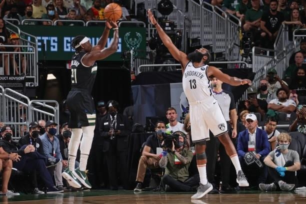 Jrue Holiday of the Milwaukee Bucks shoots the ball against James Harden of the Brooklyn Nets during Round 2, Game 6 of the 2021 NBA Playoffs on June...