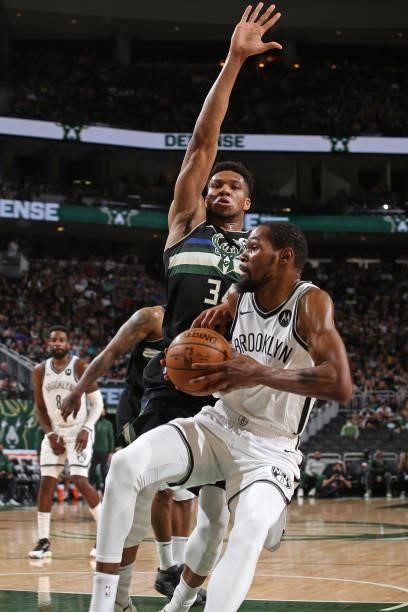 Giannis Antetokounmpo of the Milwaukee Bucks plays defense on Kevin Durant of the Brooklyn Nets during Round 2, Game 5 of the 2021 NBA Playoffs on...