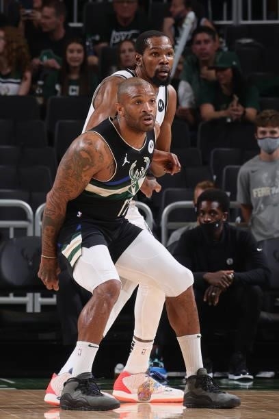 Kevin Durant of the Brooklyn Nets and P.J. Tucker of the Milwaukee Bucks look on during Round 2, Game 6 of the 2021 NBA Playoffs on June 17, 2021 at...