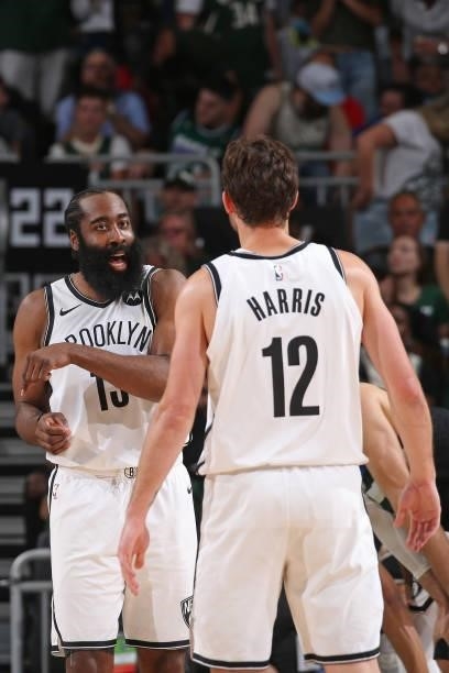 James Harden and Joe Harris of the Brooklyn Nets talk in the game against the Milwaukee Bucks during Round 2, Game 5 of the 2021 NBA Playoffs on June...