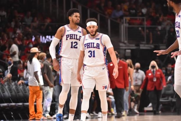 Tobias Harris of the Philadelphia 76ers and Seth Curry of the Philadelphia 76ers react during a game against the Atlanta Hawks during Round 2, Game 6...