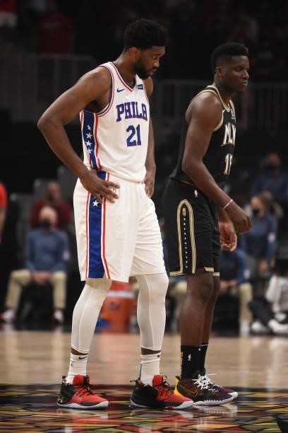 Joel Embiid of the Philadelphia 76ers and Clint Capela of the Atlanta Hawks look on during Round 2, Game 6 of the Eastern Conference Playoffs on June...