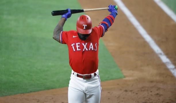 Adolis Garcia of the Texas Rangers steps away from the plate during his at bat against the Minnesota Twins during the fourth inning at Globe Life...