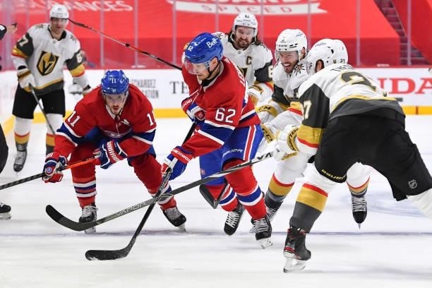 June 18: Artturi Lehkonen of the Montreal Canadiens skates with the puck under pressure from Brayden McNabb and Shea Theodore of the Vegas Golden...