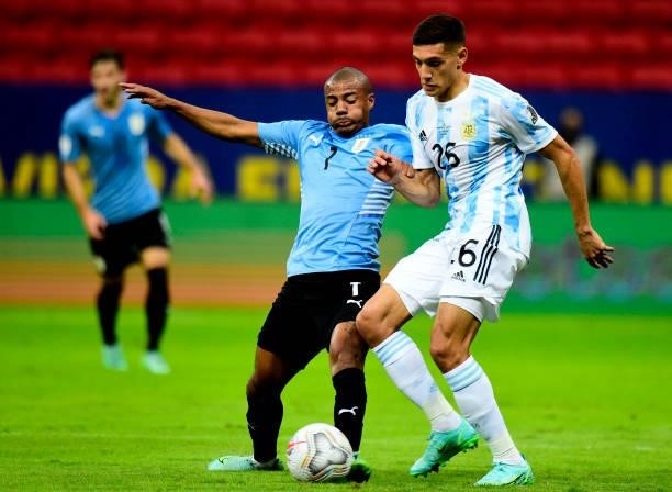 Nicolas De La Cruz of Uruguay competes for the ball with Nahuel Molina of Argentina during the match between Argentina and Uruguay as part of...
