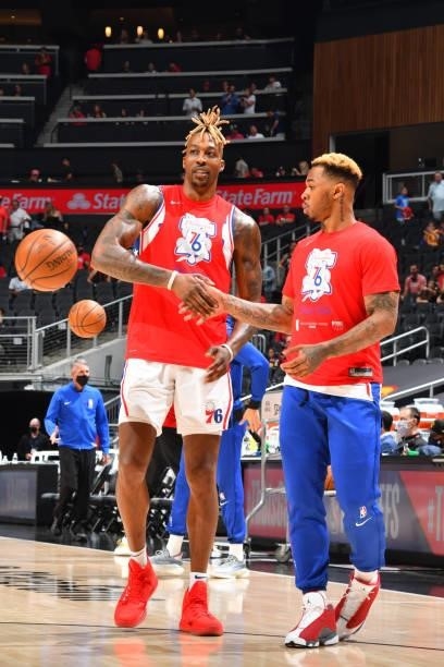 Dwight Howard of the Philadelphia 76ers and Rayjon Tucker of the Philadelphia 76ers high-five prior to a game against the Atlanta Hawks during Round...