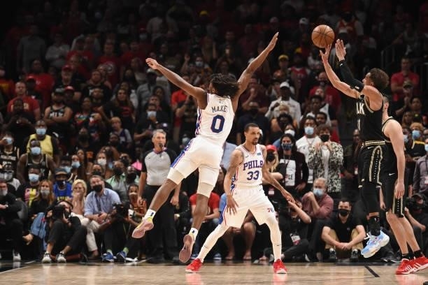 Trae Young of the Atlanta Hawks shoots a three-pointer against Tyrese Maxey of the Philadelphia 76ers during Round 2, Game 6 of the Eastern...