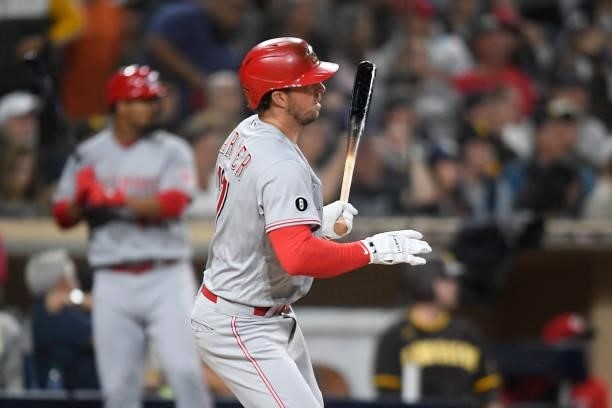 Kyle Farmer of the Cincinnati Reds hits an RBI single during the fourth inning of a baseball game against the San Diego Padres at Petco Park on June...