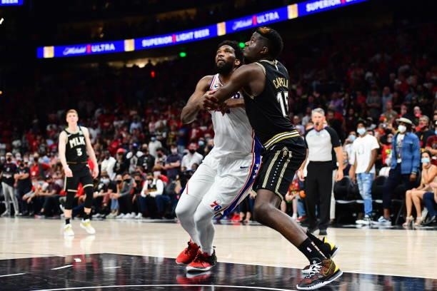 Joel Embiid of the Philadelphia 76ers and Clint Capela of the Atlanta Hawks fight for position during the game during Round 2, Game 6 of the Eastern...