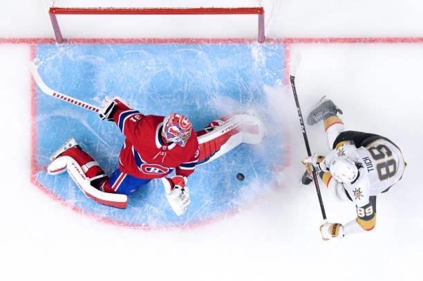 June 18: Carey Price of the Montreal Canadiens makes a save in front of Alex Tuch of the Vegas Golden Knights in Game Three of the Stanley Cup...