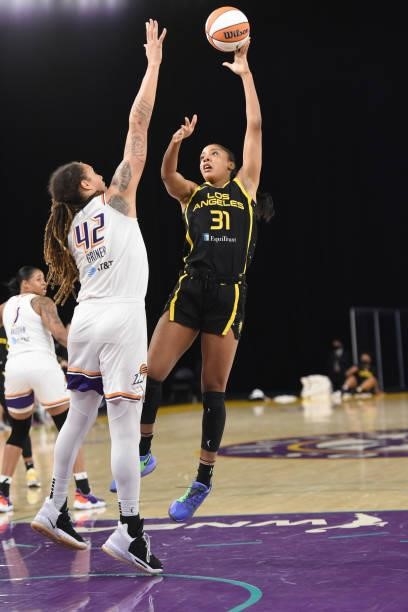 Kristine Anigwe of the Los Angeles Sparks shoots the ball over Brittney Griner of the Phoenix Mercury on June 18, 2021 at the Los Angeles Convention...