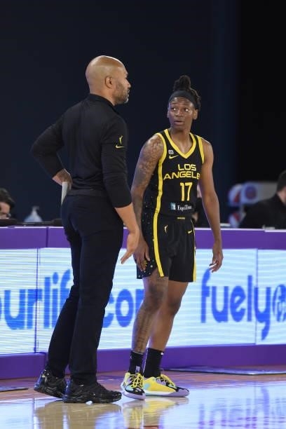 Head Coach Derek Fisher and Erica Wheeler of the Los Angeles Sparks talk during the game against the Phoenix Mercury on June 18, 2021 at the Los...
