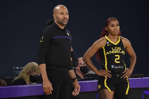 Te'a Cooper and Head Coach Derek Fisher of the Los Angeles Sparks look on during the game against the Phoenix Mercury on June 18, 2021 at the Los...