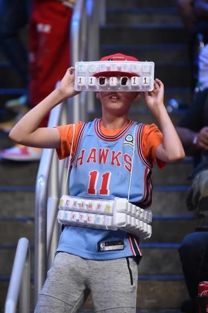 Young Atlanta Hawks celebrates wearing ice trays during Round 2, Game 6 of the Eastern Conference Playoffs on June 18, 2021 at State Farm Arena in...