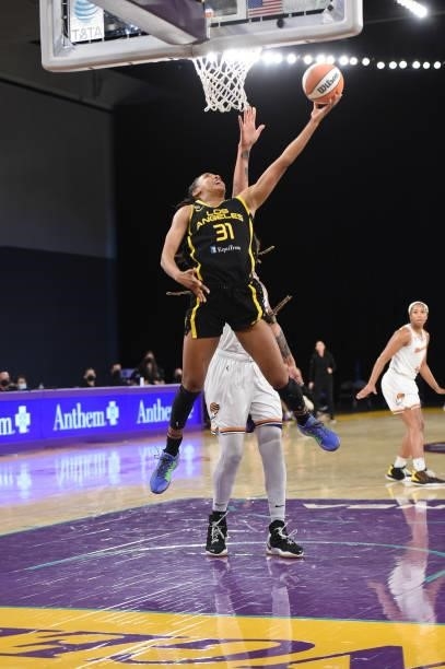 Kristine Anigwe of the Los Angeles Sparks drives to the basket against the Phoenix Mercury on June 18, 2021 at the Los Angeles Convention Center in...