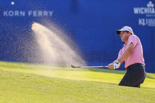 Matt Atkins plays his shot out of a bunker on the 17th green during the second round of the Wichita Open Benefitting KU Wichita Pediatrics at...