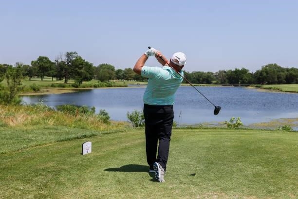 Kyle Jones plays his shot from the 7th tee during the second round of the Wichita Open Benefitting KU Wichita Pediatrics at Crestview Country Club on...
