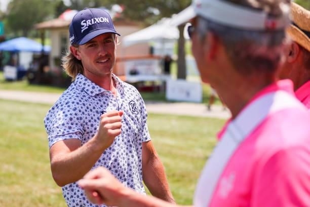Jake Knapp thanks a volunteer on the 18th green during the second round of the Wichita Open Benefitting KU Wichita Pediatrics at Crestview Country...