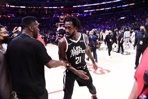 Patrick Beverley of the LA Clippers talks to Rapper and Entrepreneur, Sean Combs, after the game against the Utah Jazz during Round 2, Game 6 of the...