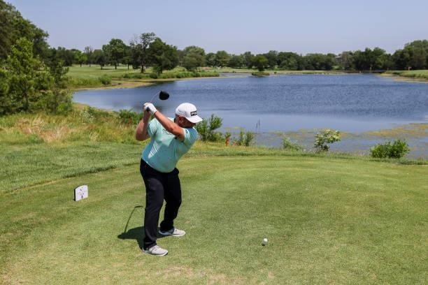 Kyle Jones plays his shot from the 7th tee during the second round of the Wichita Open Benefitting KU Wichita Pediatrics at Crestview Country Club on...
