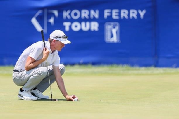 Jonathan Hodge lines up his putt on the 18th green during the second round of the Wichita Open Benefitting KU Wichita Pediatrics at Crestview Country...