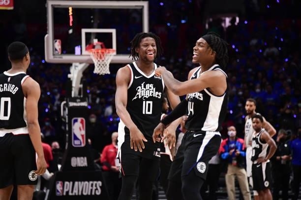 Daniel Oturu of the LA Clippers and Terance Mann of the LA Clippers smile during the game against the Utah Jazz during Round 2, Game 6 of the 2021...