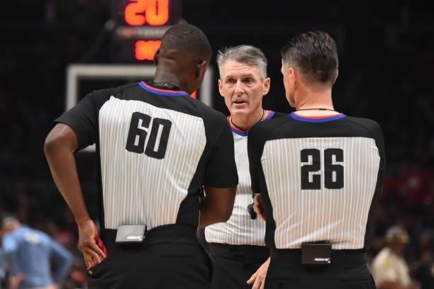 Referee James Williams and referee Pat Fraher talk to referee Scott Foster during Round 2, Game 6 of the Eastern Conference Playoffs on June 18, 2021...