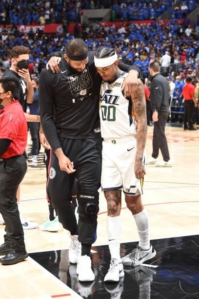 DeMarcus Cousins of the LA Clippers puts his arm around Jordan Clarkson of the Utah Jazz after the game during Round 2, Game 6 of the 2021 NBA...