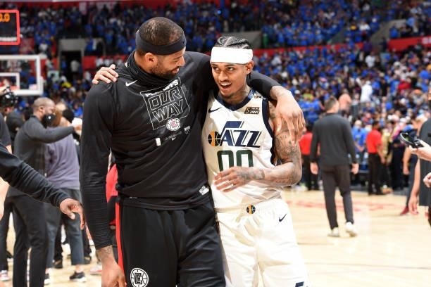 DeMarcus Cousins of the LA Clippers puts his arm around Jordan Clarkson of the Utah Jazz after the game during Round 2, Game 6 of the 2021 NBA...