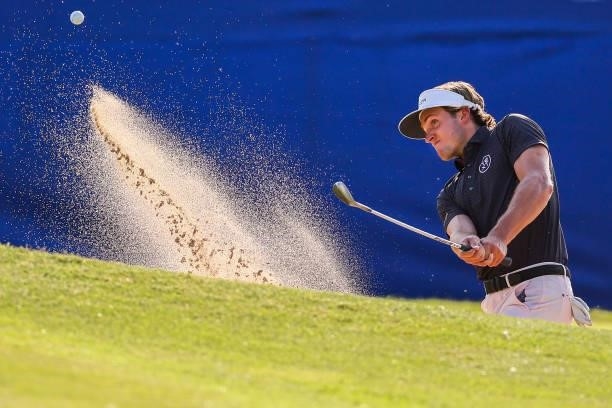 James Nicholas plays his shot out of a bunker on the 17th green during the second round of the Wichita Open Benefitting KU Wichita Pediatrics at...