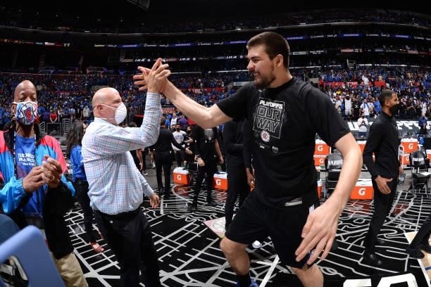 Ivica Zubac of the LA Clippers high-fives Owner Steve Ballmer after the game against the Utah Jazz during Round 2, Game 6 of the 2021 NBA Playoffs on...