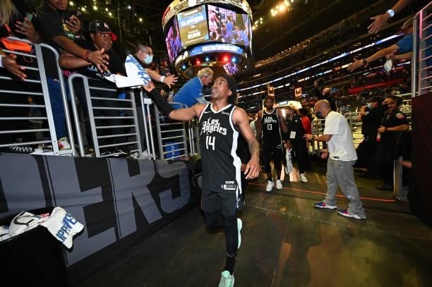 Terance Mann of the LA Clippers high fives fans after the game against the Utah Jazz during Round 2, Game 6 of the 2021 NBA Playoffs on June 18, 2021...