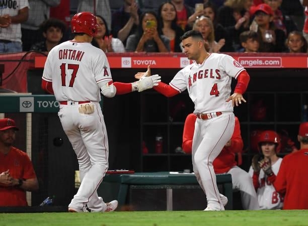 Shohei Ohtani of the Los Angeles Angels is congratulated by Jose Iglesias after hitting his second home run of the game, a solo shot, in the eighth...