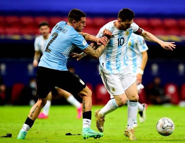 Lionel Messi of Argentina competes for the ball with Jose Gimenez of Uruguay ,during the match between Argentina and Uruguay as part of Conmebol Copa...
