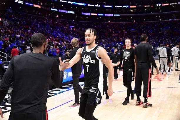 Amir Coffey of the LA Clippers high fives Rajon Rondo of the LA Clippers after the game against the Utah Jazz during Round 2, Game 6 of the 2021 NBA...