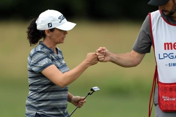Mo Martin celebrates with caddie after her birdie on the 10th green during the second round of the Meijer LPGA Classic for Simply Give golf...