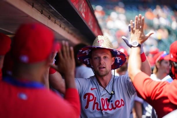 Rhys Hoskins of the Philadelphia Phillies celebrates in the dugout after hitting a home run during the game between the Philadelphia Phillies and the...