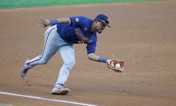 Luis Arraez of the Minnesota Twins fields a ground ball to third base off the bat of Eli White of the Texas Rangers before throwing him out at first...