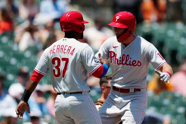 Rhys Hoskins of the Philadelphia Phillies celebrates with Odúbel Herrera after hitting a two run home run during the game between the Philadelphia...