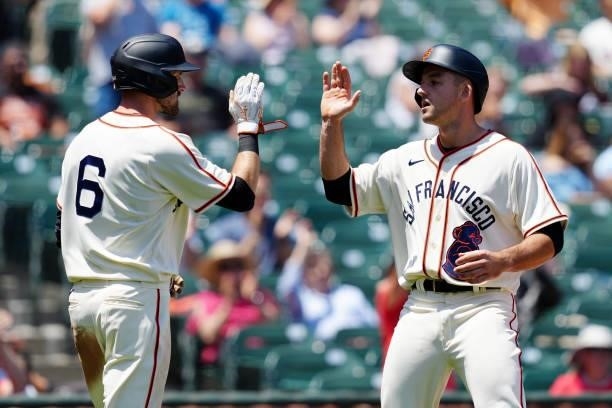 Jason Vosler and Steven Duggar of the San Francisco Giants celebrate after scoring during the game between the Philadelphia Phillies and the San...
