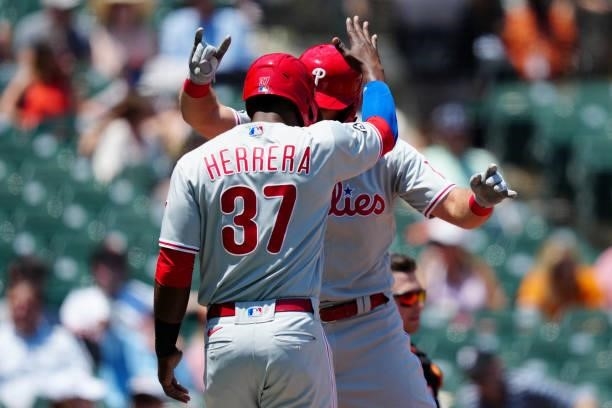 Rhys Hoskins of the Philadelphia Phillies celebrates with Odúbel Herrera after hitting a two run home run during the game between the Philadelphia...