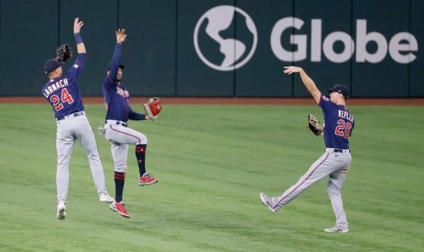 Trevor Larnach of the Minnesota Twins along with teammates Byron Buxton and Max Kepler celebrate the team's 3-2 win over the Texas Rangers at Globe...